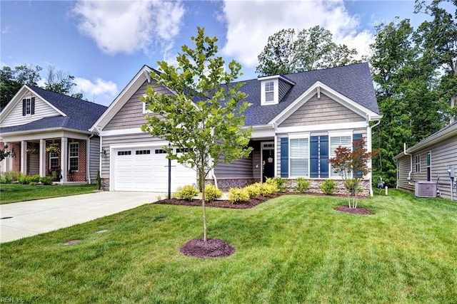 3998 Isaac Cir, Williamsburg, VA 23188 - view of front of property with a garage, driveway, stone siding, and a front yard