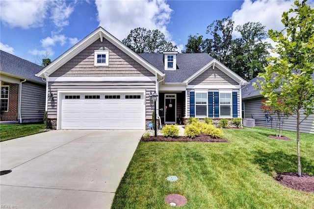 3998 Isaac Cir, Williamsburg, VA 23188 - craftsman-style home with driveway, a front lawn, an attached garage, and stone siding