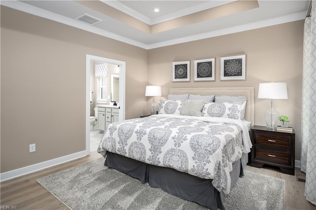 105 Repose Rd, Williamsburg, VA 23185 - bedroom with a tray ceiling, crown molding, light wood-style floors, recessed lighting, and ensuite bathroom