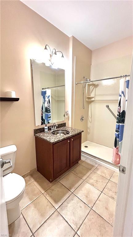 450 W Princess Anne Rd Unit 208, Norfolk, VA 23517 - bathroom with a shower stall, vanity, and tile patterned floors