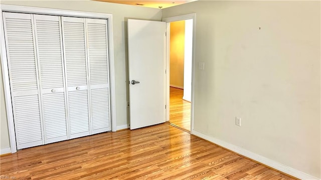 450 W Princess Anne Rd Unit 208, Norfolk, VA 23517 - unfurnished bedroom featuring light wood-style floors and a closet