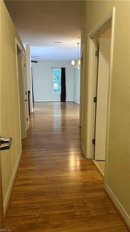 450 W Princess Anne Rd Unit 208, Norfolk, VA 23517 - hallway featuring wood finished floors and a chandelier