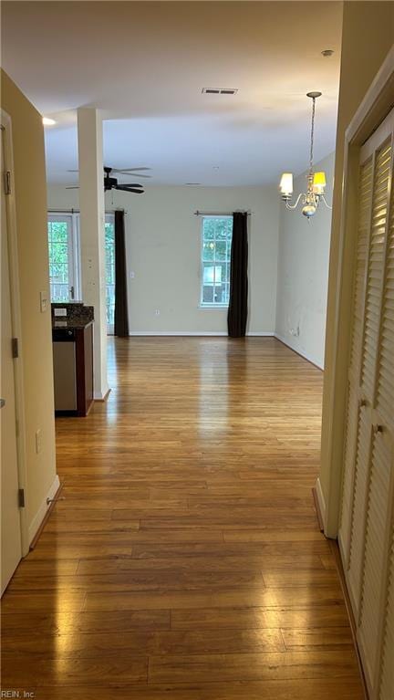 450 W Princess Anne Rd Unit 208, Norfolk, VA 23517 - hallway featuring light wood-type flooring and a chandelier