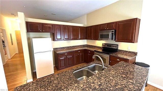 450 W Princess Anne Rd Unit 208, Norfolk, VA 23517 - kitchen with stainless steel appliances, light wood-type flooring, and dark stone counters