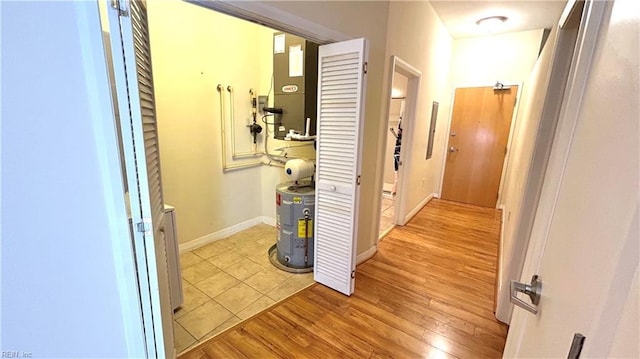 450 W Princess Anne Rd Unit 208, Norfolk, VA 23517 - hall featuring water heater and light wood-type flooring