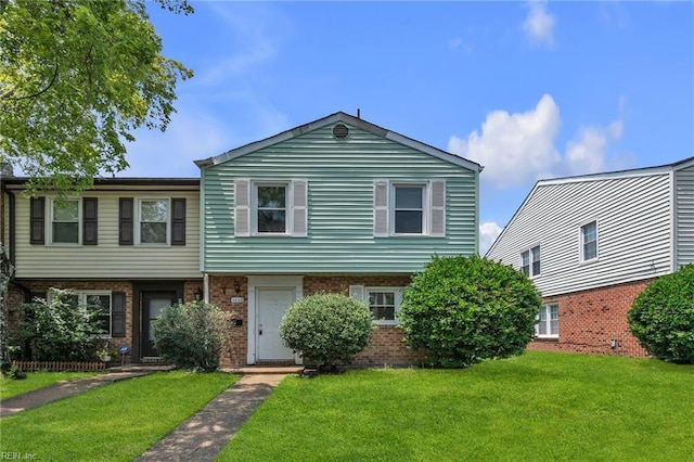 6625 Stoney Pt, Norfolk, VA 23502 - view of front of house with a front yard and brick siding