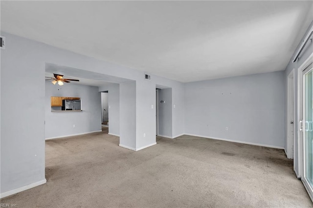 6625 Stoney Pt, Norfolk, VA 23502 - unfurnished living room featuring light colored carpet and a ceiling fan