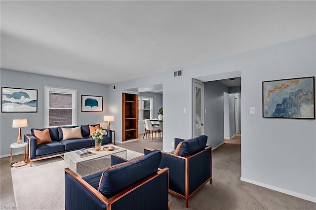 6625 Stoney Pt, Norfolk, VA 23502 - living area with plenty of natural light, carpet flooring, and arched walkways