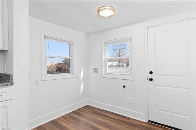 2850 Grandy Ave, Norfolk, VA 23509 - unfurnished dining area featuring baseboards and dark wood-style floors