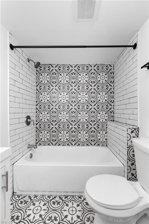 2850 Grandy Ave, Norfolk, VA 23509 - full bathroom with washtub / shower combination, tile patterned flooring, and vanity