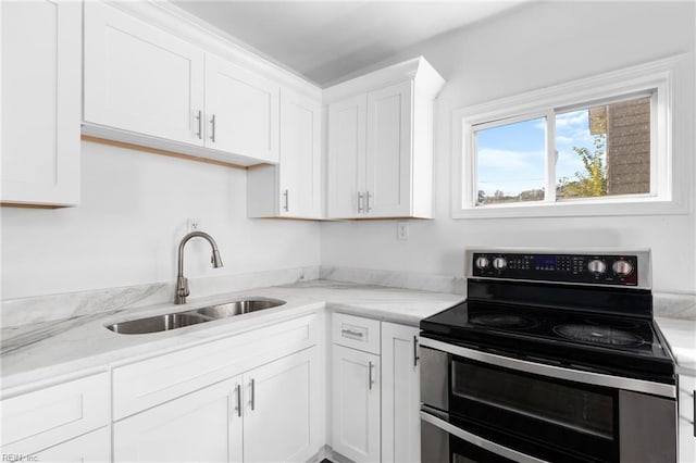 2850 Grandy Ave, Norfolk, VA 23509 - kitchen featuring double oven range, white cabinets, and light stone countertops