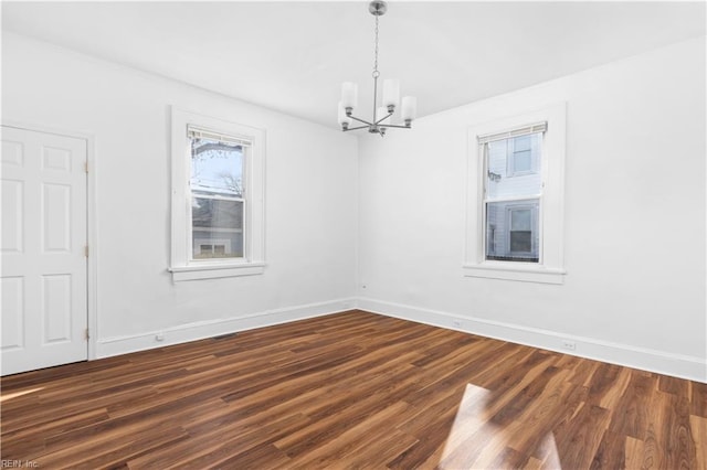 2850 Grandy Ave, Norfolk, VA 23509 - unfurnished dining area featuring a chandelier and dark wood-type flooring