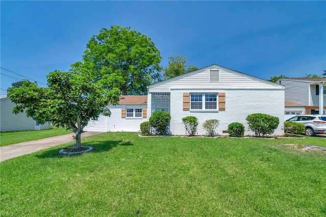 3 Maume Cir, Hampton, VA 23666 - view of front facade with a front lawn, concrete driveway, and brick siding