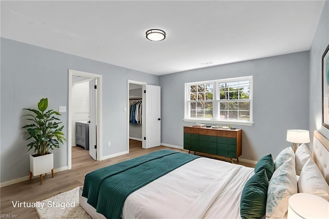 3 Maume Cir, Hampton, VA 23666 - bedroom with wood finished floors, a spacious closet, connected bathroom, and a closet