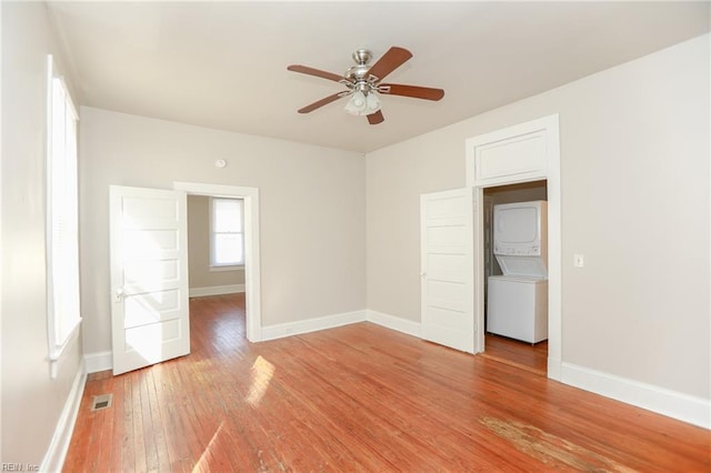 1439 Moultrie Ave, Norfolk, VA 23509 - unfurnished bedroom featuring stacked washer / drying machine, light wood-type flooring, and ceiling fan