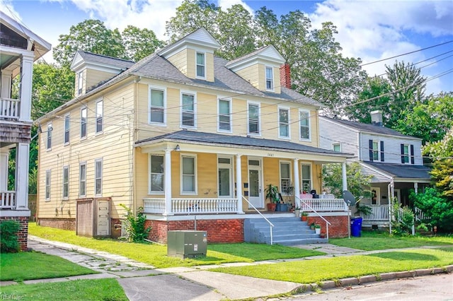 1439 Moultrie Ave, Norfolk, VA 23509 - view of front facade with a porch and a front yard