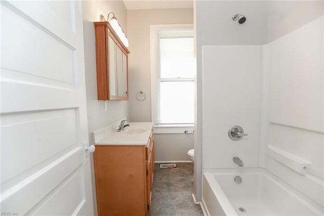 1439 Moultrie Ave, Norfolk, VA 23509 - full bathroom with vanity, stone finish flooring, and shower / tub combination