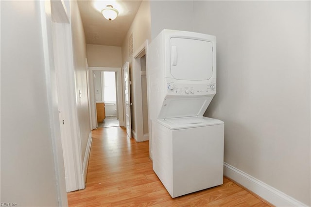 1439 Moultrie Ave, Norfolk, VA 23509 - laundry area featuring stacked washer / dryer and light wood-style flooring