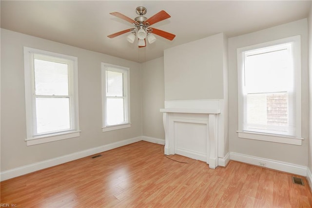 1439 Moultrie Ave, Norfolk, VA 23509 - unfurnished living room with light wood-type flooring and ceiling fan