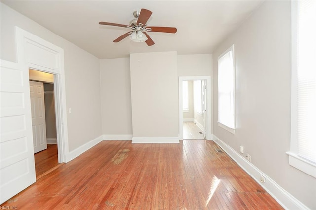 1439 Moultrie Ave, Norfolk, VA 23509 - unfurnished bedroom featuring light wood-style floors, multiple windows, and a ceiling fan