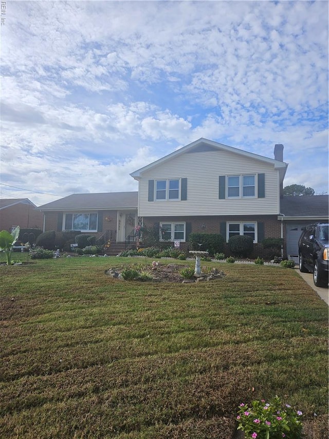 904 Flintfield Cres, Chesapeake, VA 23321 - tri-level home with a front lawn, a chimney, and an attached garage