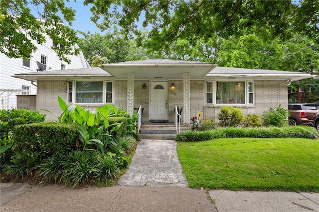 963 Woodrow Ave Unit A, Norfolk, VA 23517 - view of front of property featuring brick siding and a front lawn