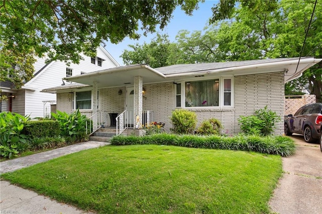 963 Woodrow Ave Unit A, Norfolk, VA 23517 - view of front of home with brick siding and a front yard