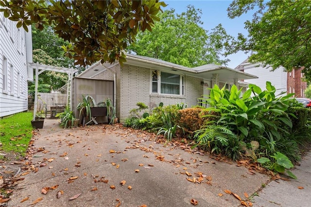 963 Woodrow Ave Unit A, Norfolk, VA 23517 - view of side of home with brick siding and a patio area