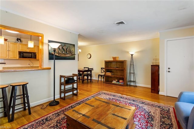 963 Woodrow Ave Unit A, Norfolk, VA 23517 - living room featuring wood finished floors and ornamental molding