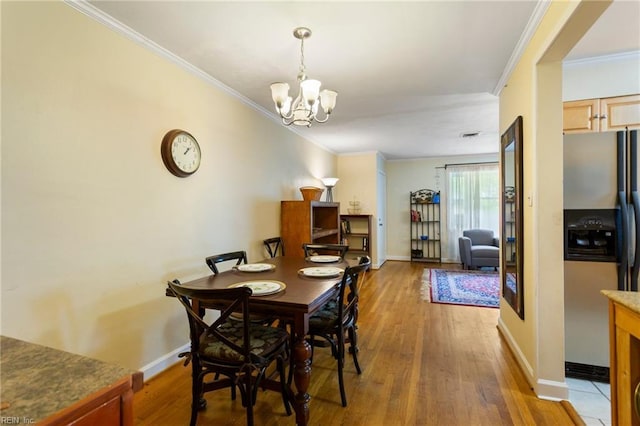 963 Woodrow Ave Unit A, Norfolk, VA 23517 - dining area featuring wood finished floors, ornamental molding, and a chandelier