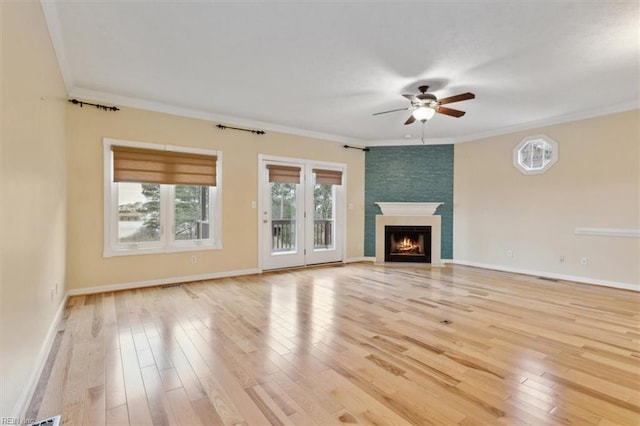 367 Mainsail Dr Unit 23, Hampton, VA 23664 - unfurnished living room featuring ceiling fan, light wood-style flooring, a large fireplace, and ornamental molding
