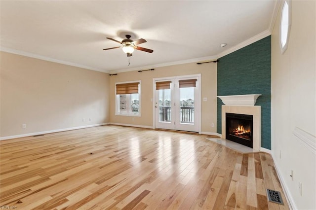 367 Mainsail Dr Unit 23, Hampton, VA 23664 - unfurnished living room featuring ceiling fan, light wood-type flooring, a fireplace with flush hearth, and crown molding