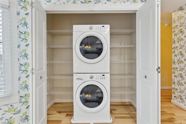 367 Mainsail Dr Unit 23, Hampton, VA 23664 - laundry room featuring stacked washing machine and dryer and wood finished floors