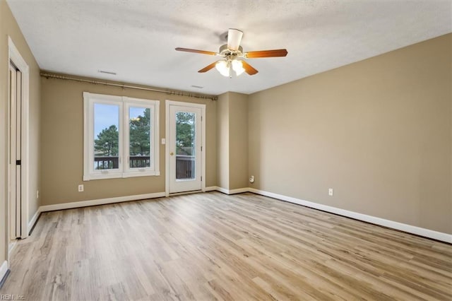 367 Mainsail Dr Unit 23, Hampton, VA 23664 - spare room featuring wood finished floors, ceiling fan, and a textured ceiling