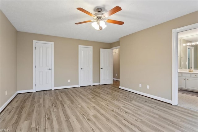 367 Mainsail Dr Unit 23, Hampton, VA 23664 - unfurnished bedroom with two closets, light wood-type flooring, ensuite bathroom, and ceiling fan