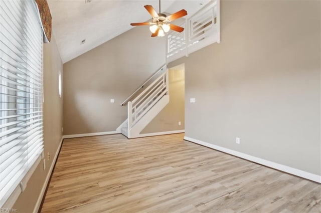 367 Mainsail Dr Unit 23, Hampton, VA 23664 - unfurnished living room featuring high vaulted ceiling, ceiling fan, light wood-style flooring, and stairway