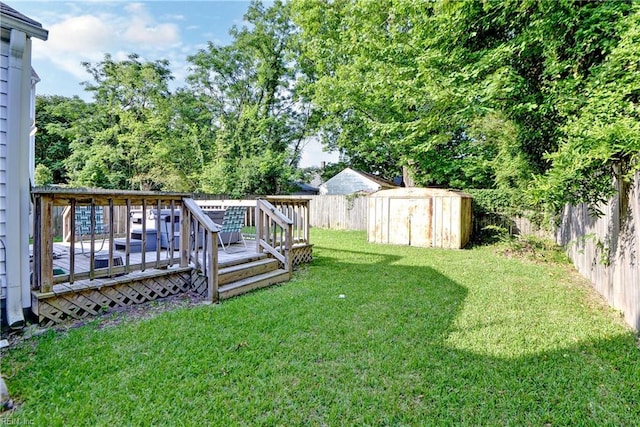 387 Sampson Ave, Hampton, VA 23661 - fenced backyard featuring a wooden deck and a shed