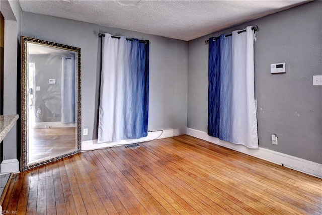 387 Sampson Ave, Hampton, VA 23661 - empty room with hardwood / wood-style floors and a textured ceiling