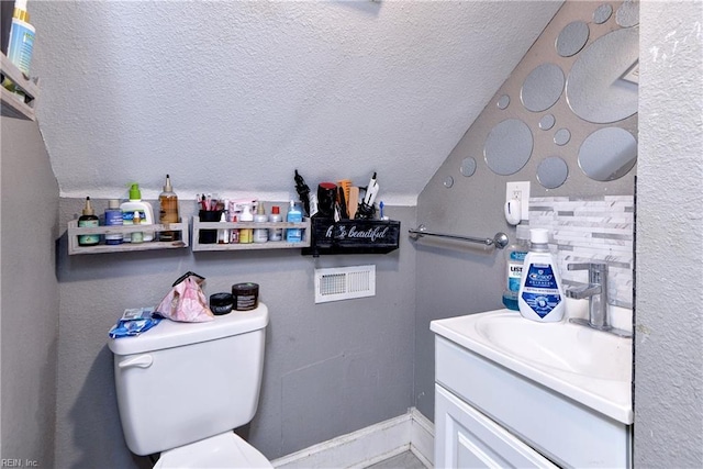 387 Sampson Ave, Hampton, VA 23661 - bathroom with vanity, a textured ceiling, and lofted ceiling