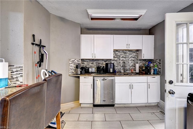 387 Sampson Ave, Hampton, VA 23661 - kitchen featuring stainless steel dishwasher, backsplash, white cabinetry, dark stone counters, and a textured ceiling