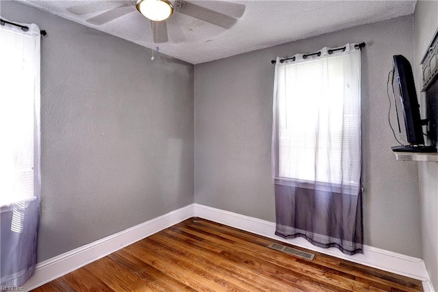 387 Sampson Ave, Hampton, VA 23661 - empty room featuring plenty of natural light, ceiling fan, and wood finished floors