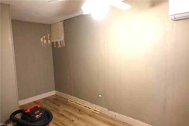 806 Lee St, West Point, VA 23181 - spare room with a wall mounted AC and light wood-style flooring