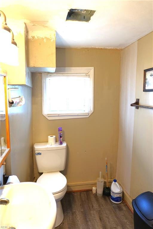 806 Lee St, West Point, VA 23181 - half bath featuring wood finished floors and toilet