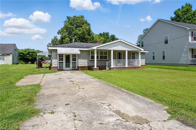 1816 Long Ridge Rd, Chesapeake, VA 23323 - view of front of home featuring a porch and a front lawn