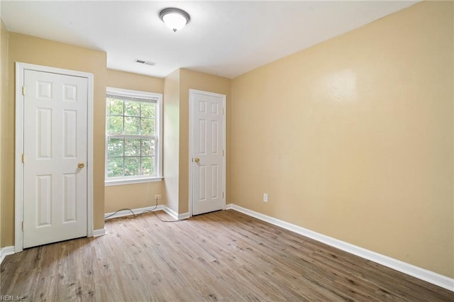 1118 35th St, Newport News, VA 23607 - unfurnished room with wood finished floors and baseboards