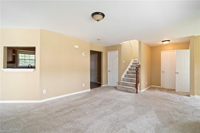 1118 35th St, Newport News, VA 23607 - carpeted spare room with stairway and baseboards