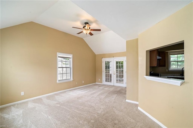 1118 35th St, Newport News, VA 23607 - unfurnished living room featuring ceiling fan, french doors, vaulted ceiling, and carpet floors