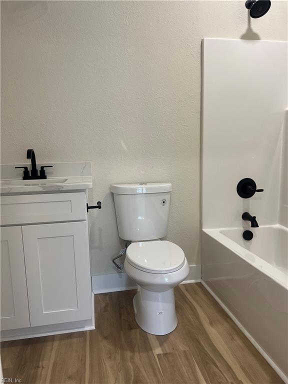 1635 E Bayview Blvd, Norfolk, VA 23503 - bathroom with wood finished floors, vanity, and shower / tub combination