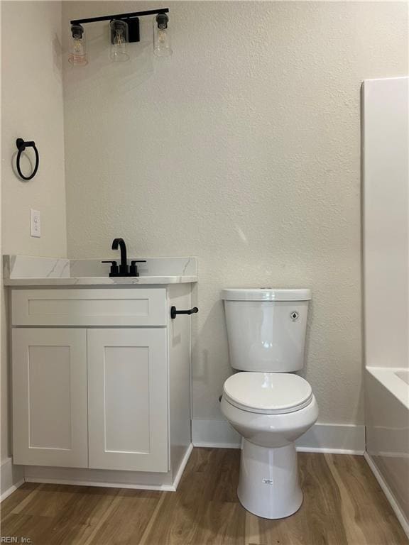 1635 E Bayview Blvd, Norfolk, VA 23503 - bathroom with wood finished floors, vanity, and a tub