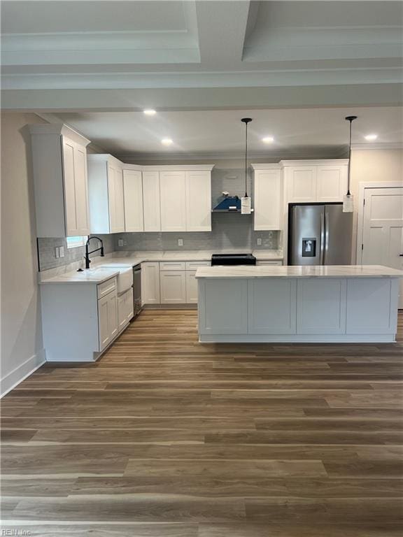 1635 E Bayview Blvd, Norfolk, VA 23503 - kitchen with stainless steel appliances, light countertops, decorative backsplash, a center island, and dark wood-type flooring